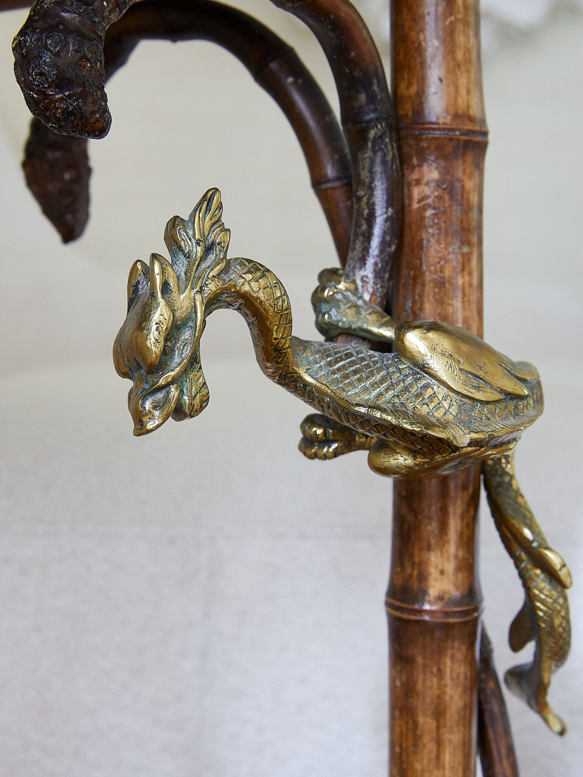 Antique chinoiserie table with brass dragons and bamboo legs from modern interior designers