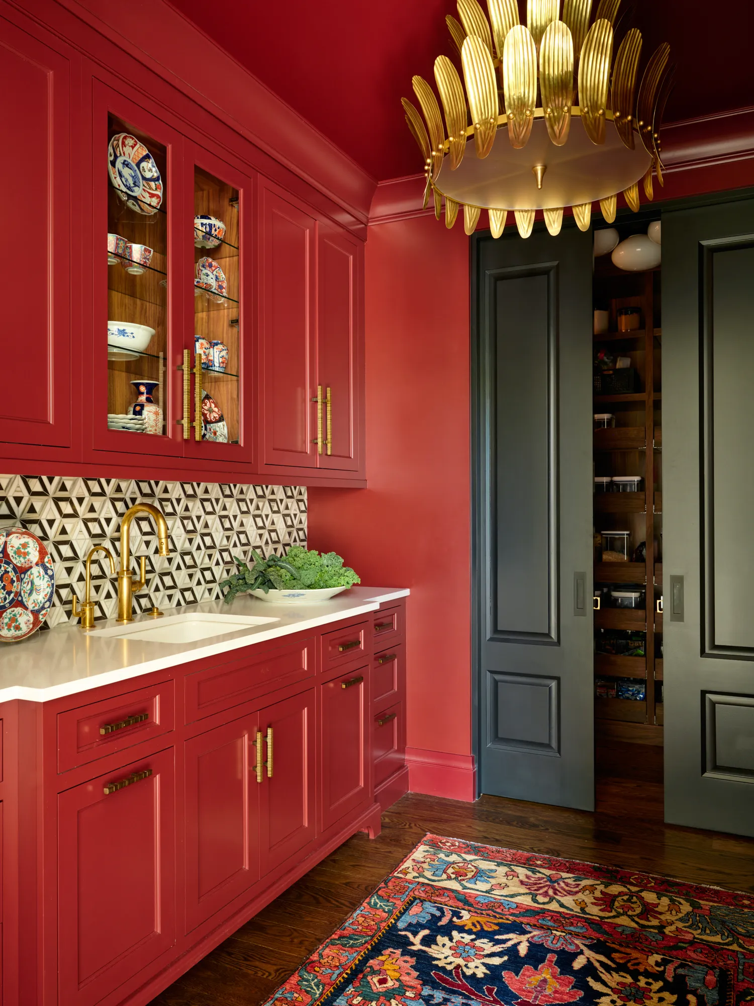 Cherry Hills kitchen red cabinetry patterned backsplash