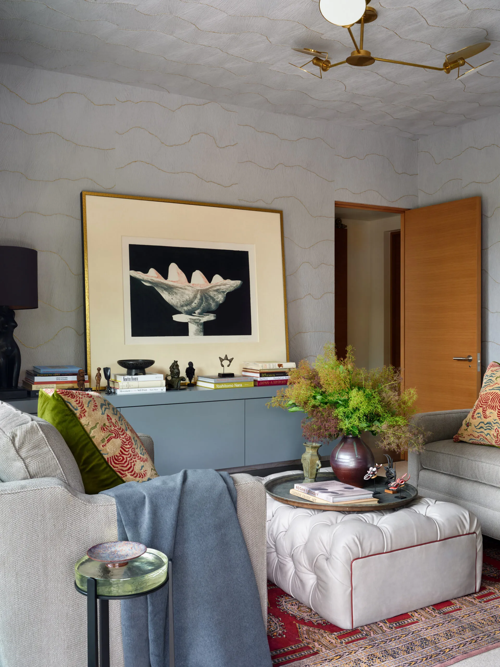 Layered primary bedroom with collected furnishings in Santa Barbara luxury home