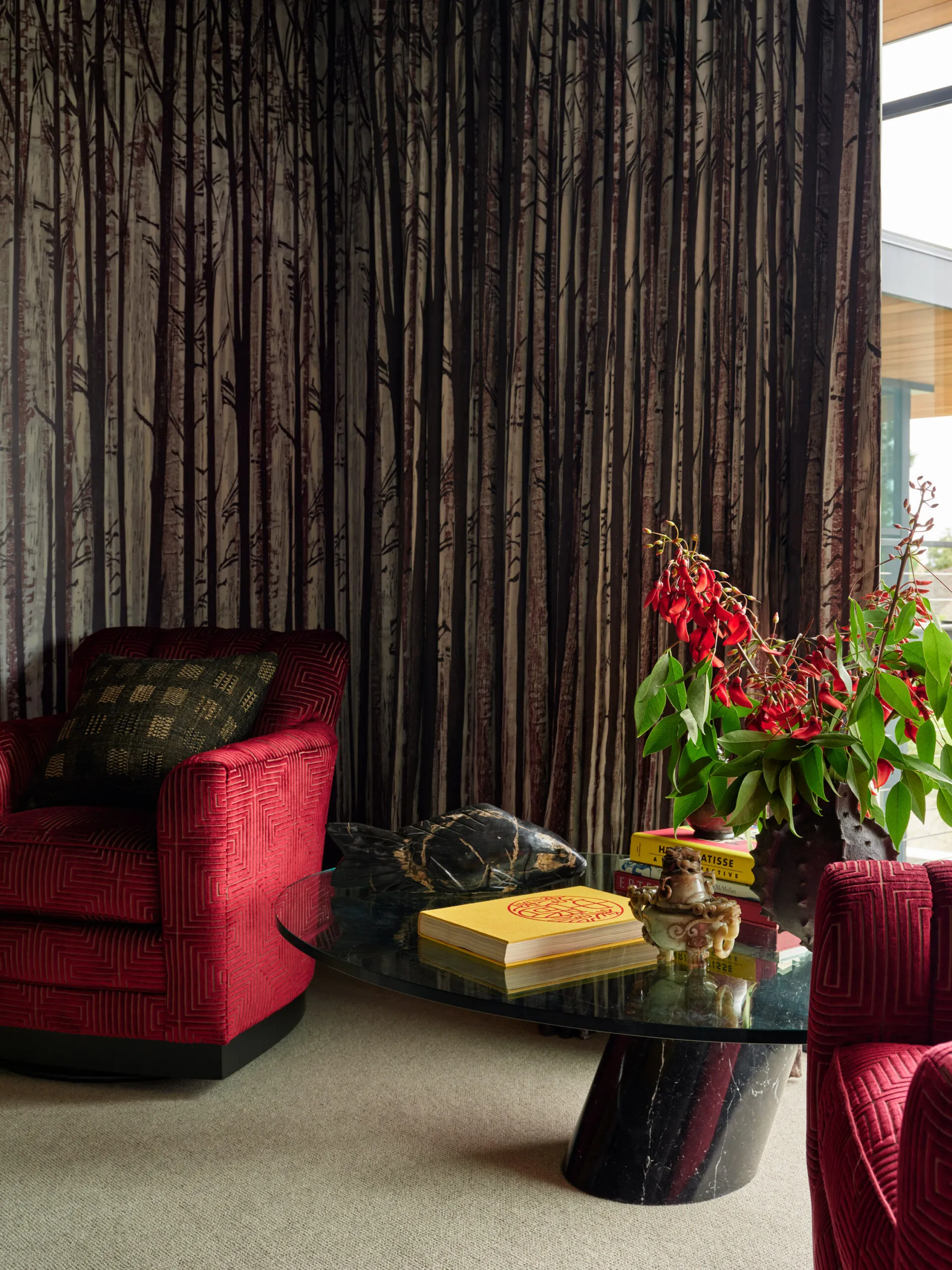 Collected sitting area with rich drapery and layered textures in California coastal home