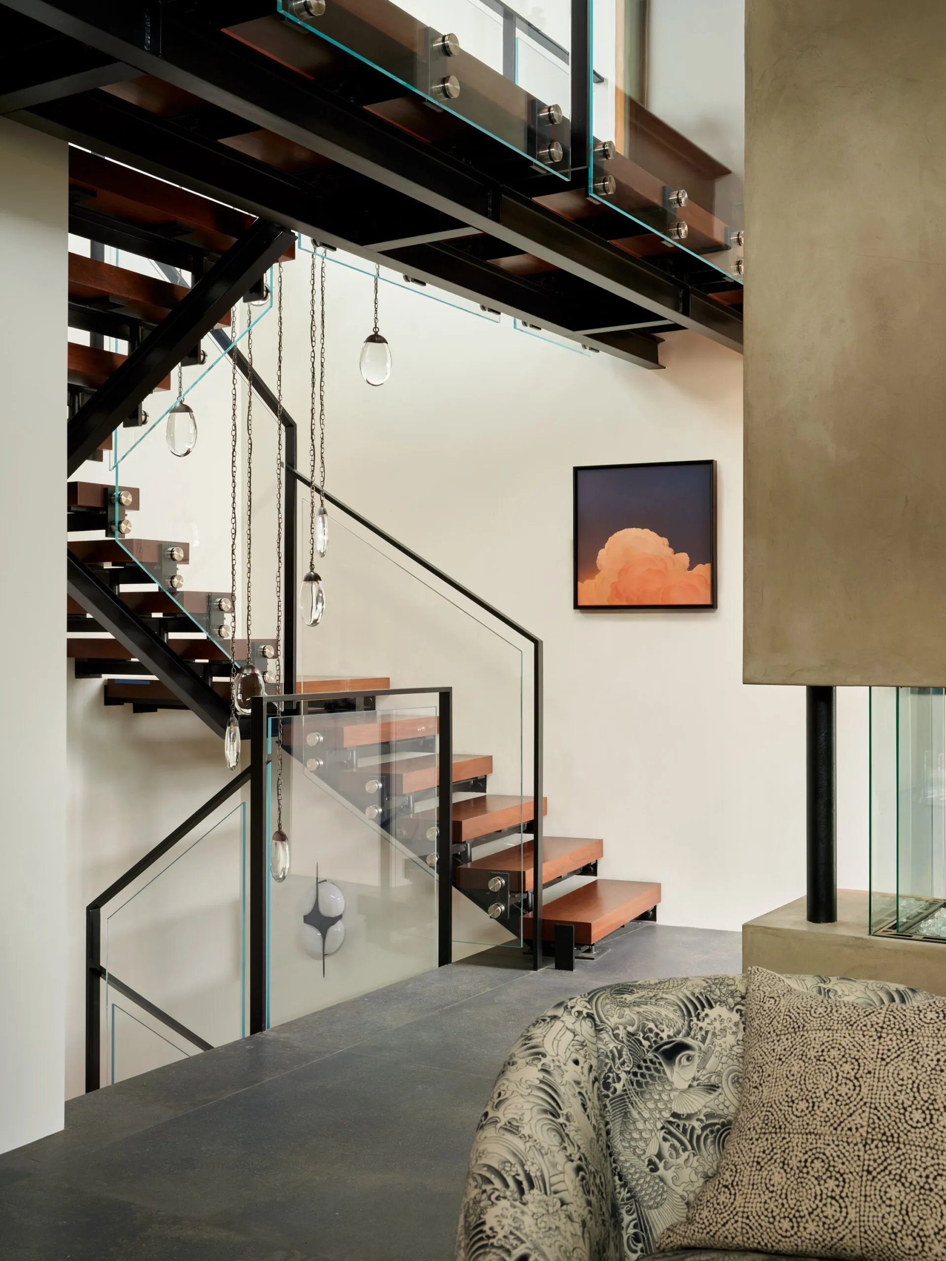 Modern staircase with glass railing in luxury Santa Barbara residence