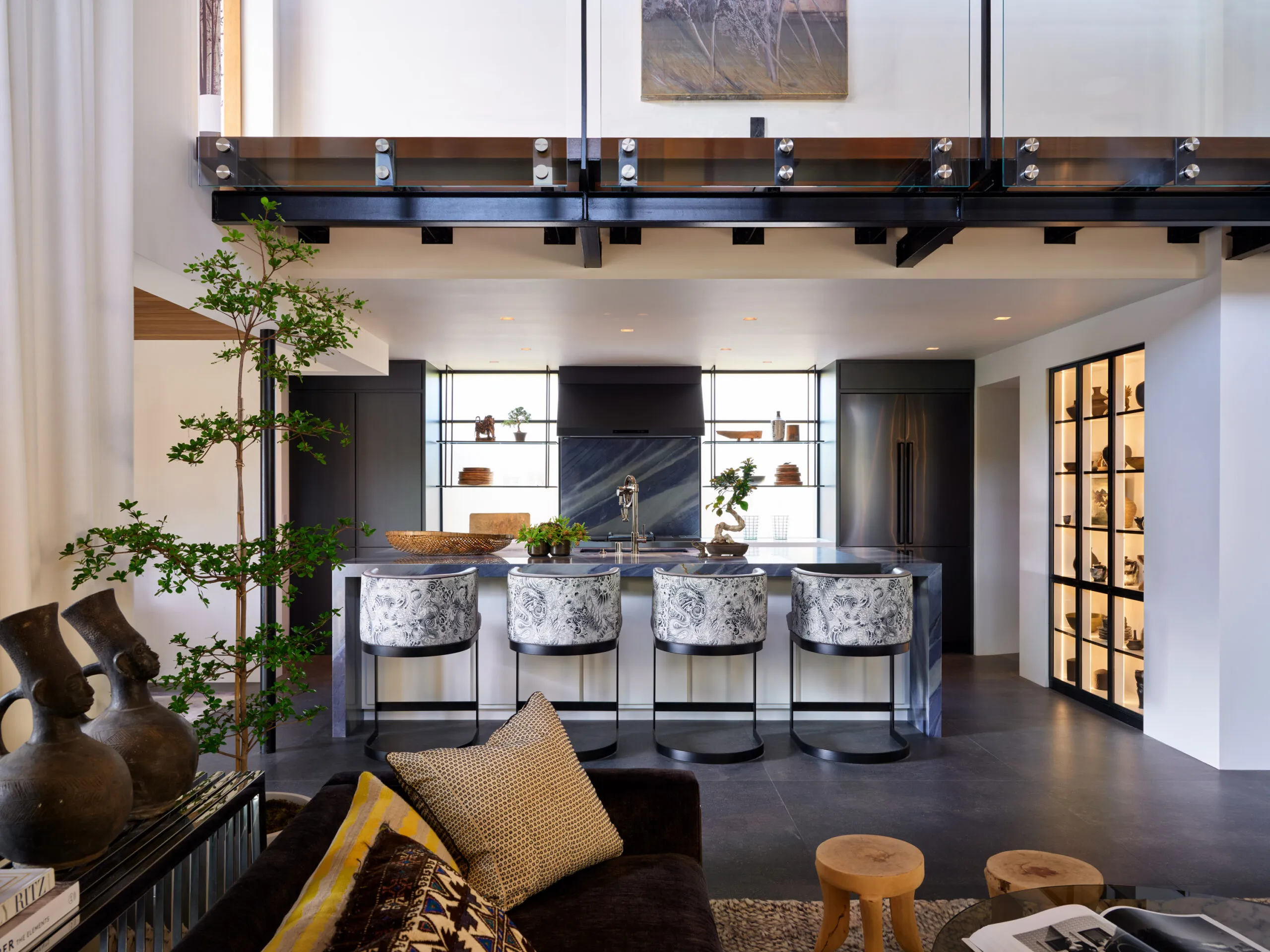Open concept luxury kitchen and dining area with custom stone island in Santa Barbara residence