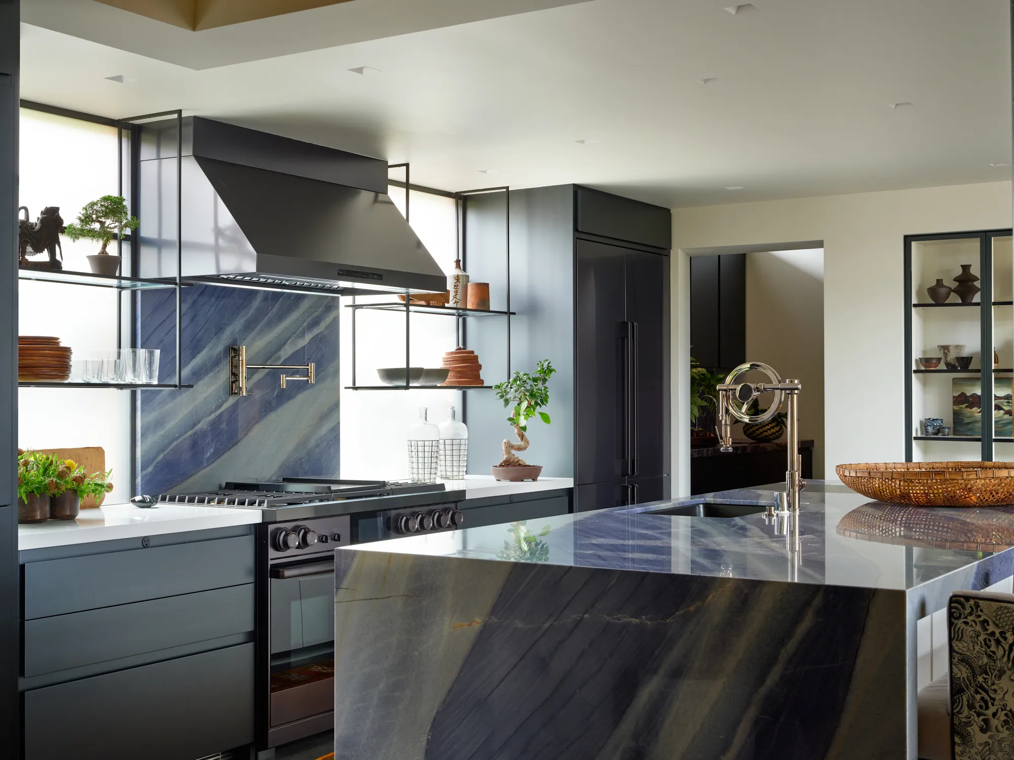 Luxury Santa Barbara kitchen with dramatic stone countertops and custom cabinetry
