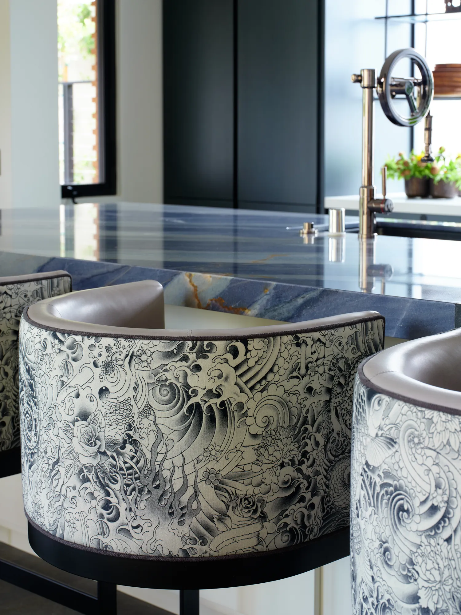 Sculptural carved stone sinks in a modern Santa Barbara powder room