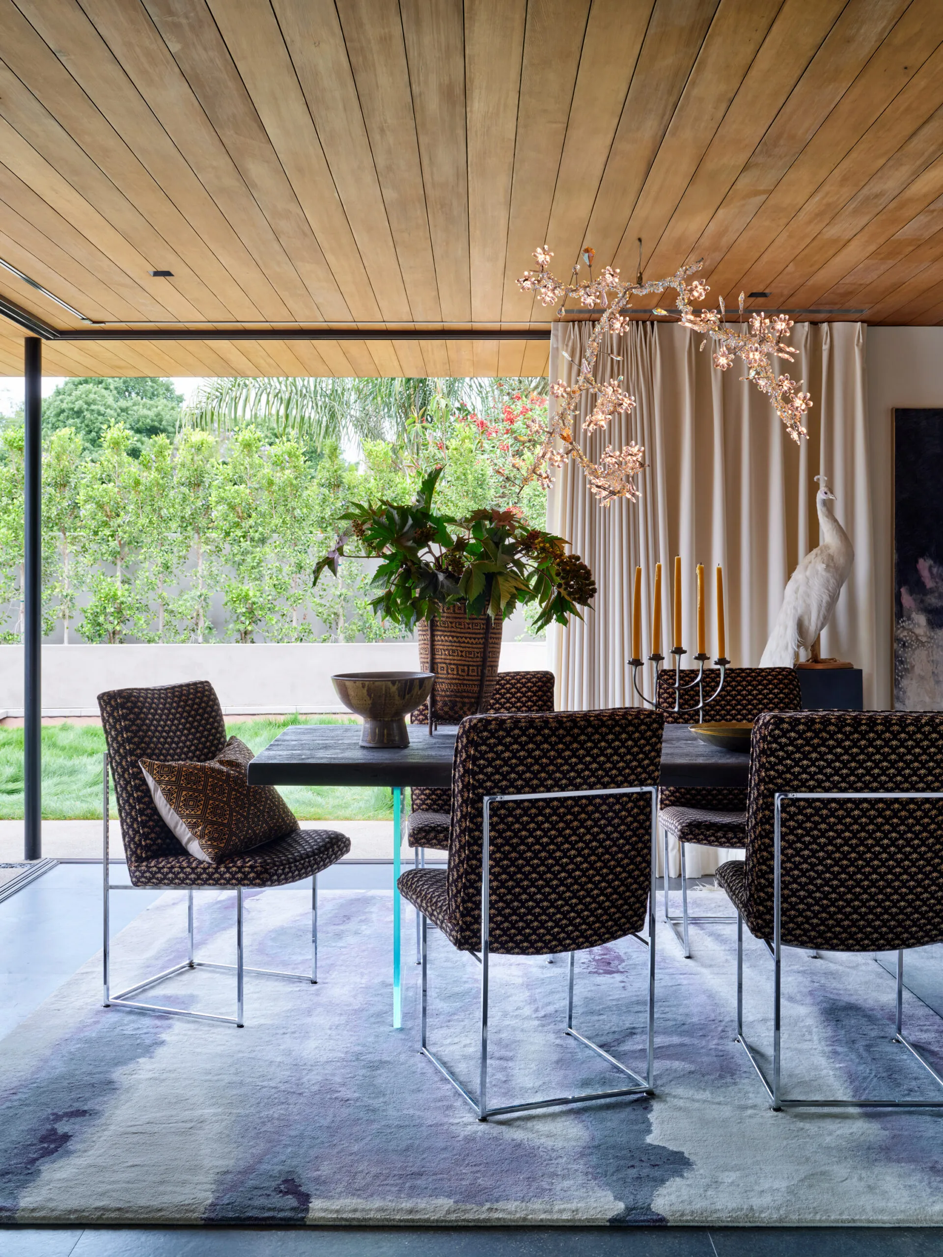 Luxury Santa Barbara dining room with sculptural chandelier and indoor outdoor living by Andrea Schumacher Interiors