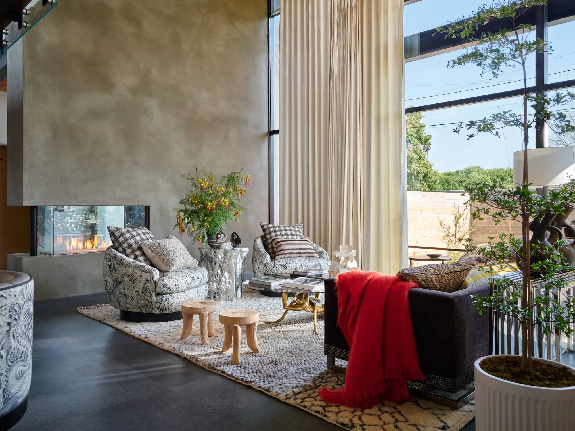 Contemporary Santa Barbara living room with expansive windows and collected interiors