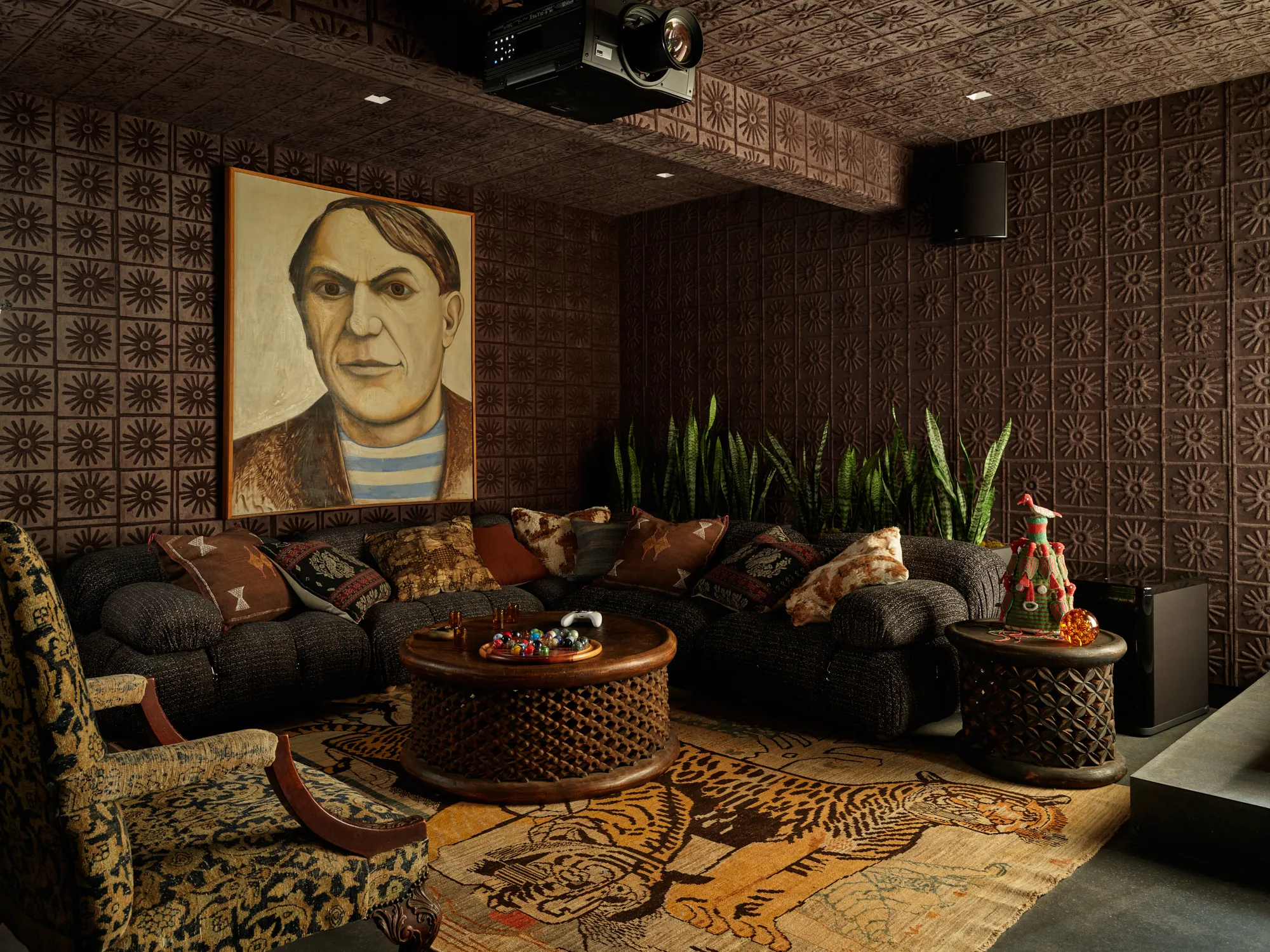 Moody media lounge with layered textures and custom furnishings in Santa Barbara residence